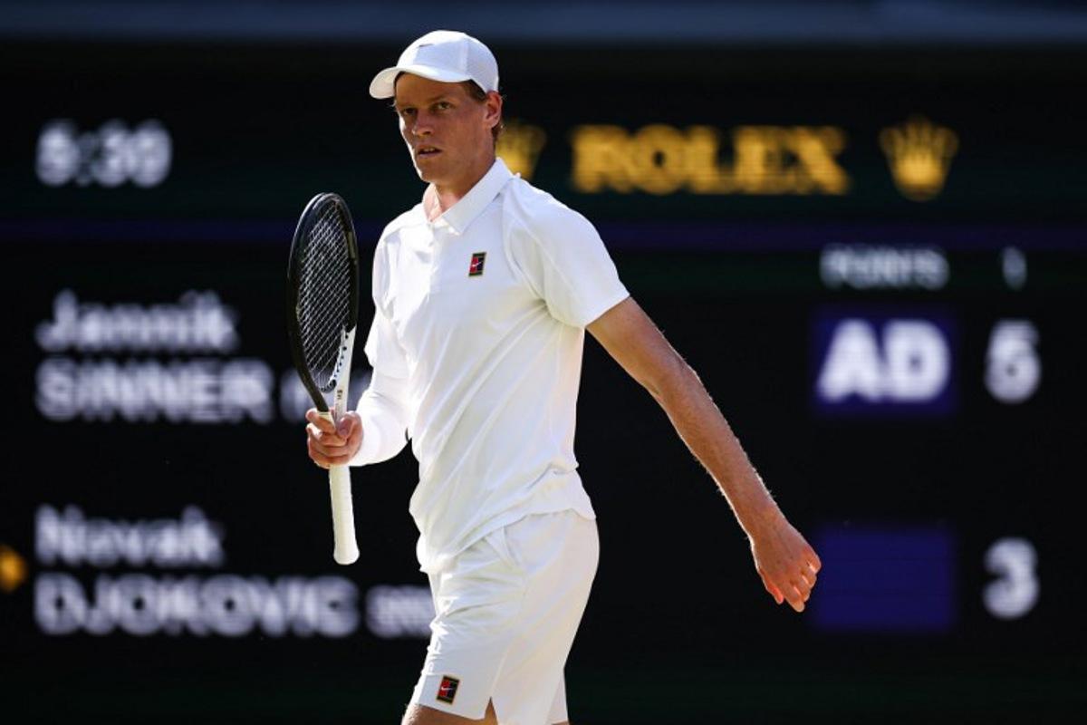 Italy's Jannik Sinner celebrates winning the first set against Serbia's Novak Djokovic during their men's singles semi-final tennis match on the twelfth day of the 2025 Wimbledon Championships at The All England Lawn Tennis and Croquet Club in Wimbledon, southwest London, on July 11, 2025.  HENRY NICHOLLS / AFP