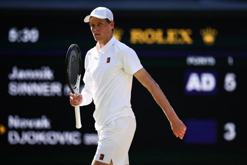 Italy's Jannik Sinner celebrates winning the first set against Serbia's Novak Djokovic during their men's singles semi-final tennis match on the twelfth day of the 2025 Wimbledon Championships at The All England Lawn Tennis and Croquet Club in Wimbledon, southwest London, on July 11, 2025.  HENRY NICHOLLS / AFP