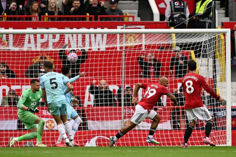 Manchester United's Cameroonian midfielder #19 Bryan Mbeumo (2R) wheels away to celebrate scoring their second goal during the English Premier League football match between Manchester United and Burnley at Old Trafford in Manchester, north west England, on August 30, 2025.  Oli SCARFF / AFP