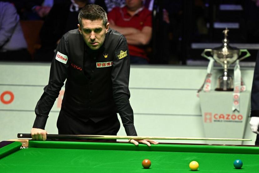 England's Mark Selby at the table while playing against Belgium's Luca Brecel during the afternoon session on day two of their World Championship Snooker final match at The Crucible in Sheffield, northern England on May 1, 2023.   Oli SCARFF / AFP