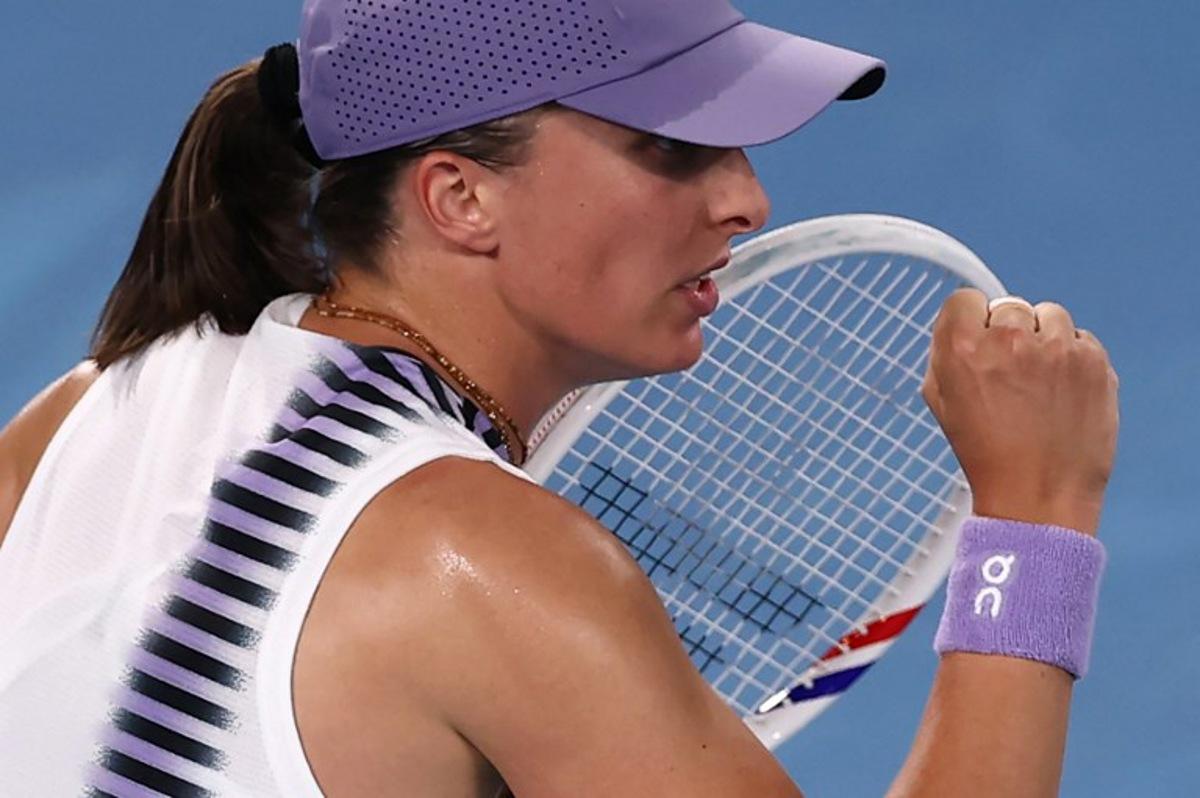 Poland's Iga Swiatek reacts after a point against Russia's Anna Kalinskaya during their women's singles match on day seven of the Australian Open tennis tournament in Melbourne on January 24, 2026.  IZHAR KHAN / AFP