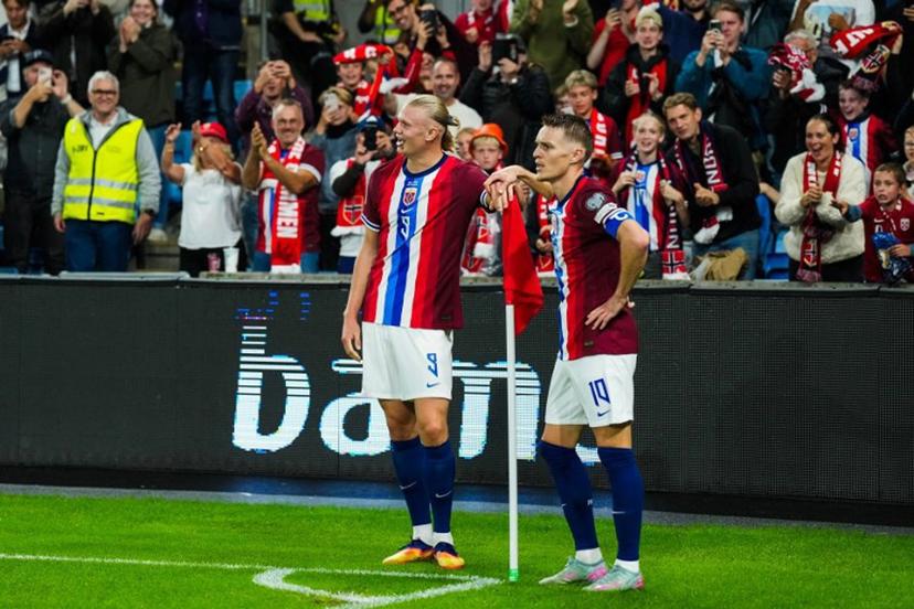 Norway's forward Erling Braut Haaland (L) and celebrates the 3-0 goal with Norway's midfielder Martin Ødegaard during the 2026 World Cup qualifiers Europe zone group I football match between Norway and Moldova on September 9, 2025 in Oslo, Norway.  Fredrik Varfjell / NTB / AFP