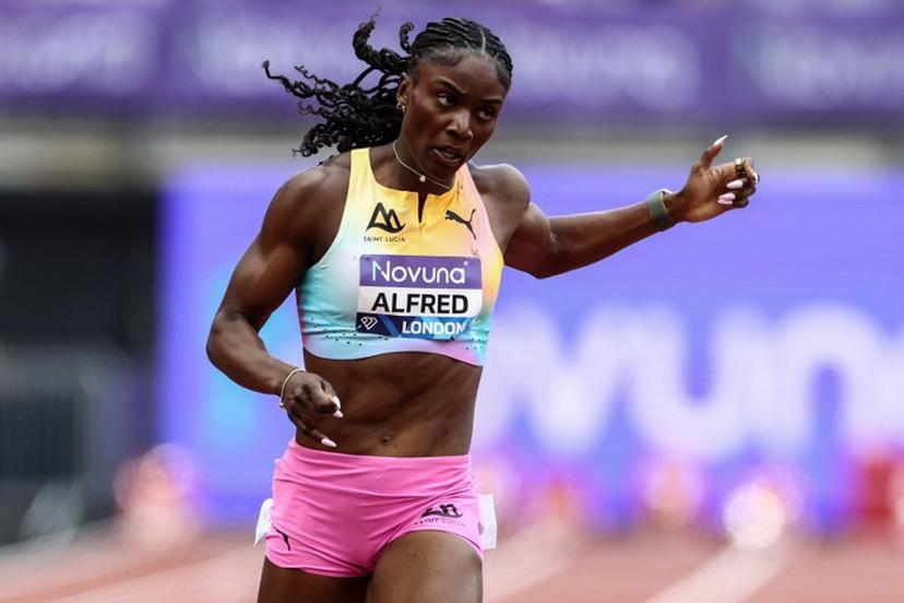 Saint Lucia's Julien Alfred crosses the finish line to win the women's 200m event during the IAAF Diamond League athletics competition at the London stadium in London on July 18, 2026.  Henry NICHOLLS / AFP