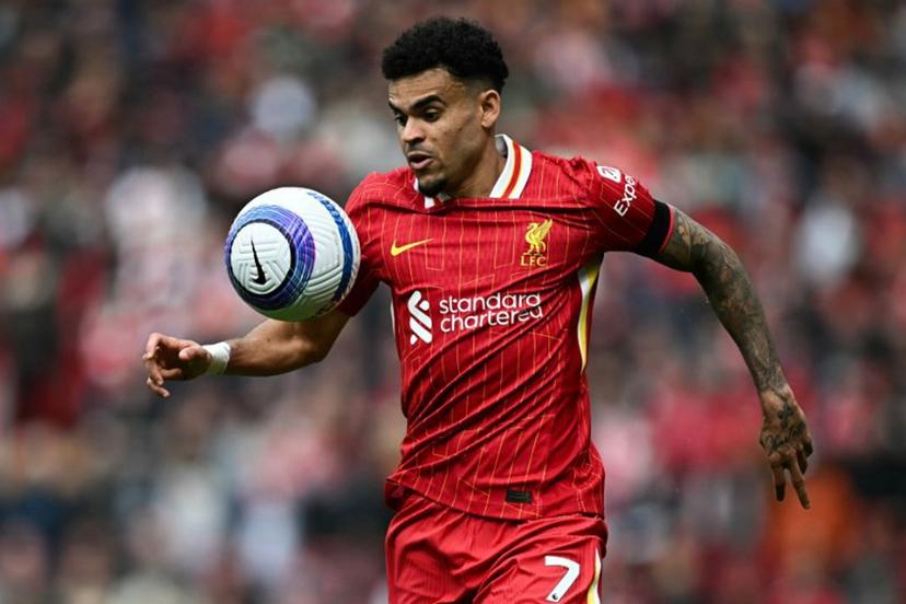 Liverpool's Colombian midfielder #07 Luis Diaz eyes the ball during the English Premier League football match between Liverpool and West Ham United at Anfield in Liverpool, north west England on April 13, 2025.  Paul ELLIS / AFP