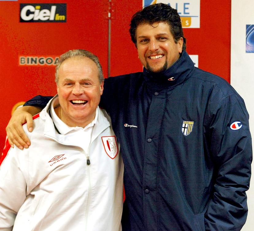 BRU117 - 20041124 - LIEGE, BELGIUM : Standard's main coach Dominique D'Onofrio (D' Onofrio) (L) poses with Silvio Baldini (R), coach of Parma, Wednesday 24 November 2004, in Liege, on the eve of the UEFA qualifying match Standard vs Parma. BELGA PHOTO MICHEL KRAKOWSKI