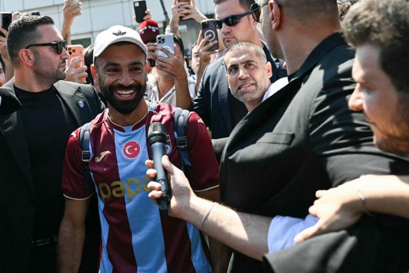 Egyptian forward Mohamed Salah reacts as he arrives at Istanbul Ataturk Airport to complete his transfer to Turkish football club Trabzonspor in Istanbul on August 5, 2026.  Ozan KOSE / AFP