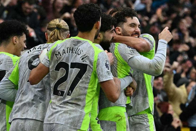 Manchester City's French midfielder #10 Rayan Cherki (R) celebrates with teammates after scoring their second goal during the English Premier League football match between Nottingham Forest and Manchester City at The City Ground in Nottingham, central England, on December 27, 2025.  Ben STANSALL / AFP