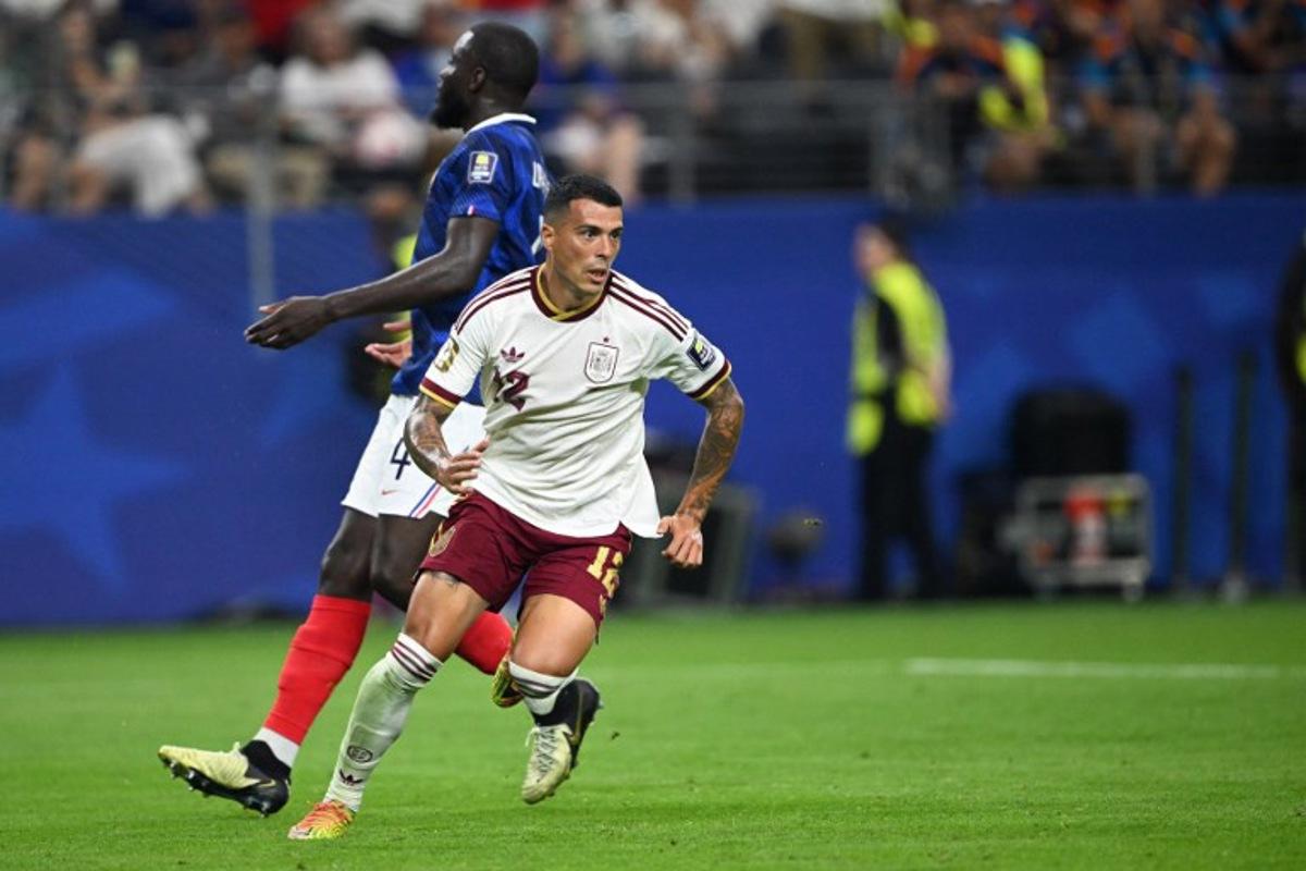 Spain's defender #12 Pedro Porro reacts after he scored his team's second goal during the 2026 World Cup football tournament semi-final match between France and Spain at the Dallas Stadium in Arlington on July 14, 2026.   MAURO PIMENTEL / AFP
