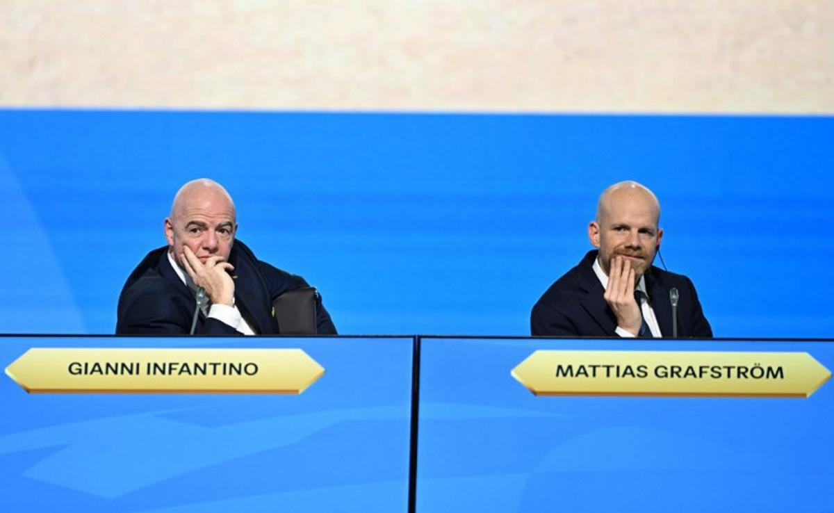 FIFA President Gianni Infantino (L) and FIFA Secretary-General Mattias Grafstrom (R) attend the 74th FIFA Congress in Bangkok on May 17, 2024. The 74th FIFA Congress is taking place in Bangkok with member associations voting on a range of issues including confirmation of the host nation or nations for the 2027 women's football World Cup. Manan VATSYAYANA / AFP