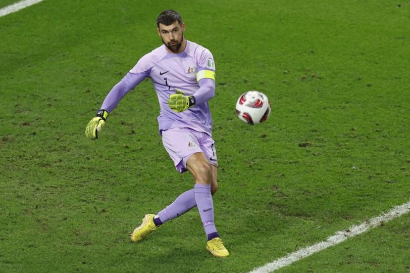 Australia's goalkeeper #01 Mathew Ryan crosses the ball during the Qatar 2023 AFC Asian Cup quarter-final football match between Australia and South Korea at Al-Janoub Stadium in al-Wakrah, south of Doha, on February 2, 2024.  KARIM JAAFAR / AFP