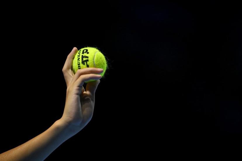 A ballboy hold up a tennis ball during a men's quarter final match at the Swiss Indoors ATP 500 tennis tournament in Basel on October 25, 2024.   Fabrice COFFRINI / AFP