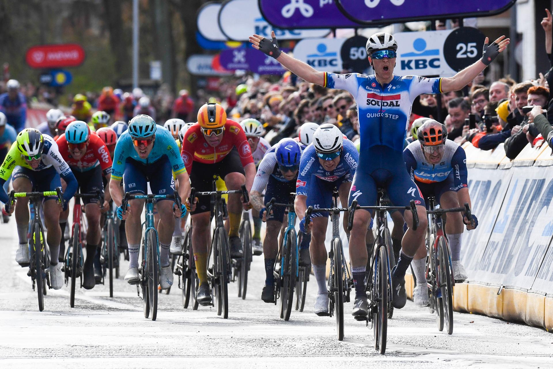 Belgian Tim Merlier of Soudal Quick-Step celebrates as he crosses the finish line to win the start of the men's race of the 112th edition of the 'Scheldeprijs' one day cycling event, 205,3 km from Terneuzen, the Netherlands to Schoten, Belgium on Wednesday 03 April 2024. BELGA PHOTO MARC GOYVAERTS