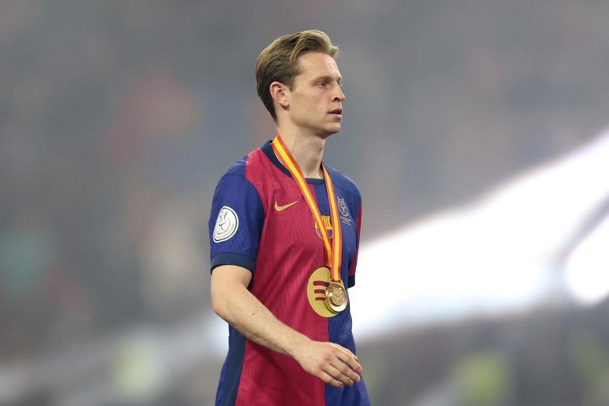 Barcelona's Dutch midfielder #21 Frenkie De Jong walks after receiving his medal at the end of the Spanish Super Cup final football match between Real Madrid and Barcelona at the King Abdullah Sport City in Jeddah on January 12, 2025.  Haitham AL-SHUKAIRI / AFP