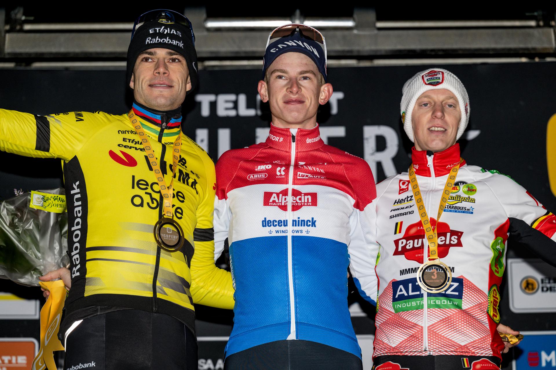 Belgian Wout van Aert, Dutch Tibor Del Grosso and Belgian Michael Vanthourenhout pictured on the podium after the men elite race at the cyclocross cycling event in Heusden-Zolder, stage 5/8 in the Superprestige competition, Tuesday 23 December 2025. BELGA PHOTO DAVID PINTENS