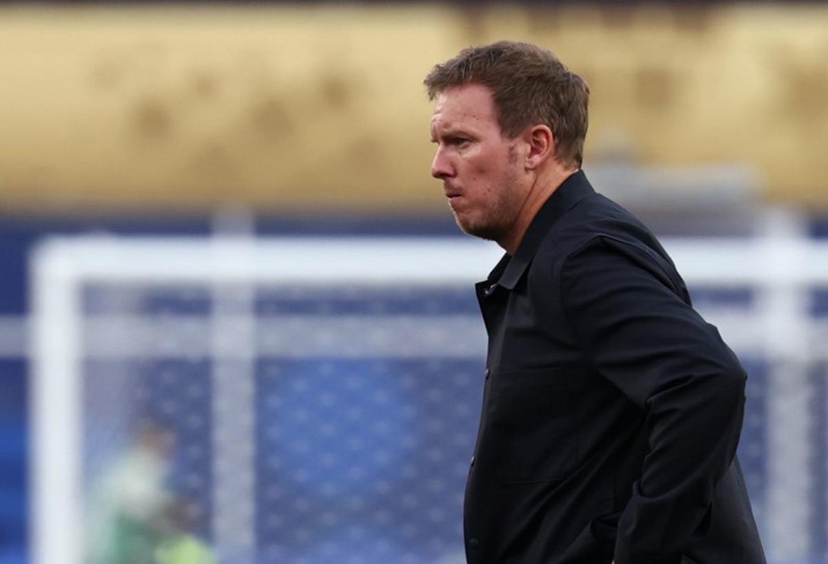 (FILES) Germany's head coach Julian Nagelsmann reacts after losing the penalty shootout during the 2026 World Cup round of 32 football match between Germany and Paraguay at the Boston Stadium in Foxborough on June 29, 2026. Germany coach Julian Nagelsmann has resigned following his team's shock last-32 exit from the World Cup at the hands of Paraguay, several media reported on Juli 3, 2026. Nagelsmann, who was under contract until the 2028 European Championship, has accepted the German Football Federation's (DFB) request for him to step down, Bild and Sky Germany reported.  FRANCK FIFE / AFP