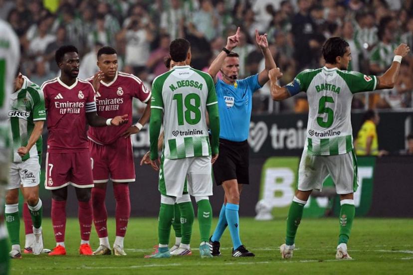 Spanish referee Alejandro Hernandez signals offside and disallows the goal scored by Real Madrid's Spanish forward #19 Carlos Espi Escrihuela during the Spanish league football match between Real Betis and Real Madrid CF at Benito Villamarin Stadium in Seville on September 4, 2026.  JORGE GUERRERO / AFP