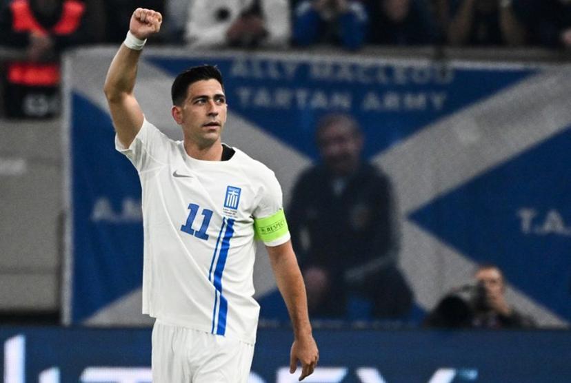 Greece's midfielder #11 Tasos Bakasetas celebrates after scoring his team's first goal during the FIFA World Cup 2026 Group C European qualification football match between Greece and Scotland at the Karaiskakis Stadium in Piraeus, on November 15, 2025.  Angelos TZORTZINIS / AFP
