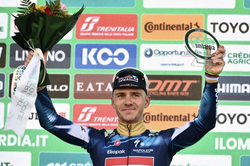 Second-placed Soudal Quick-Step's Belgian rider Remco Evenepoel celebrates on the podium after the 119th edition of the Giro di Lombardia (Tour of Lombardy), a 238km cycling race from Como to Bergamo on October 11, 2025.  Marco BERTORELLO / AFP