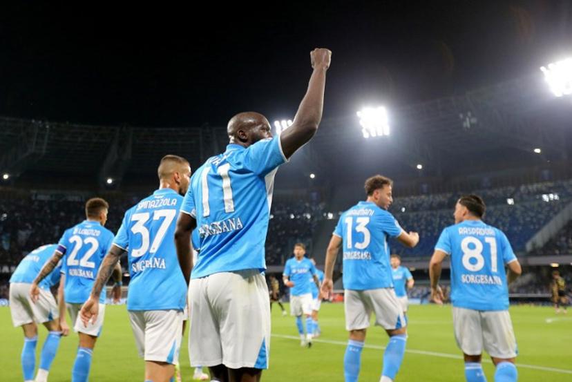 Napoli's Belgian forward #11 Romelu Lukaku (C) celebrates with teammates after scoring a goal during the Italian Serie A football match SSC Napoli vs Genoa CFC at Diego Armando Maradona Stadium in Naples, on May 11, 2025.   CARLO HERMANN / AFP