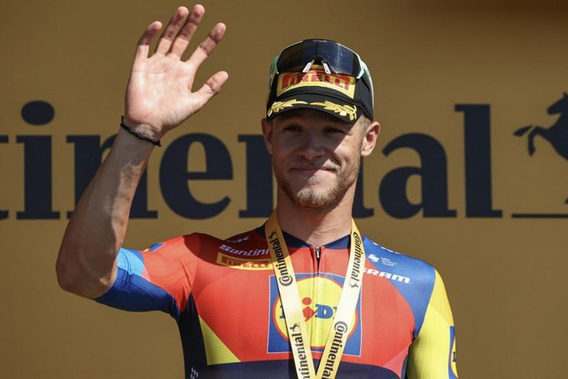 Lidl - Trek team's Italian rider Jonathan Milan celebrates on the podium after winning the 8th stage of the 112th edition of the Tour de France cycling race, 171.4 km between Saint-Meen-le-Grand and Laval Espace Mayenne, western France, on July 12, 2025.  Anne-Christine POUJOULAT / AFP