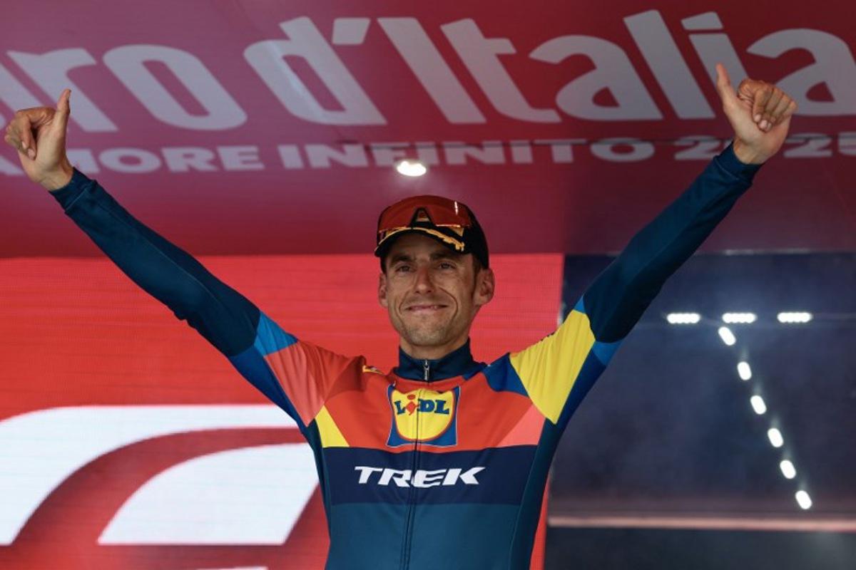 Lidl-Trek's Spanish rider Carlos Verona celebrates on the podium after victory in the 15th stage of the 108th Giro d'Italia cycling race of 219kms from Fiume Veneto to Asiago on May 25, 2025.  Luca Bettini / AFP