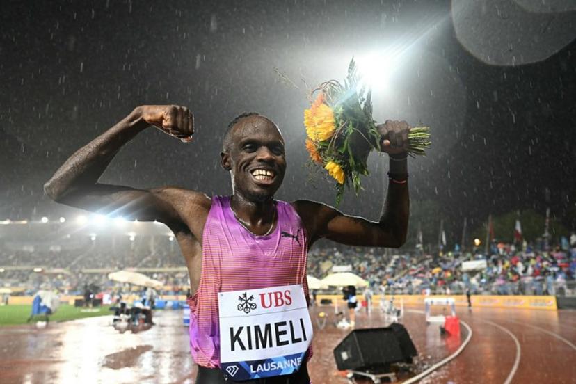 Belgium's Isaac Kimeli celebrates after winning  the men's 5000m event of the IAAF Diamond League athletics meeting "Athletissima" at Stade Olympique de la Pontaise in Lausanne, on August 20, 2025.  Fabrice COFFRINI / AFP