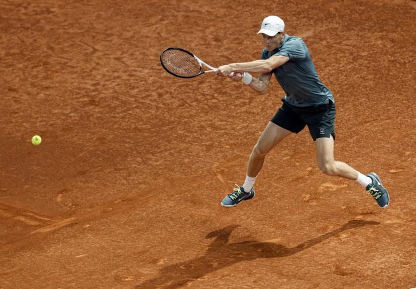 Italy's Jannik Sinner returns a ball to Spain's Rafael Jodar during their 2026 ATP Tour Madrid Open tennis tournament quarterfinal singles match at the Caja Magica in Madrid, on April 29, 2026.  OSCAR DEL POZO / AFP