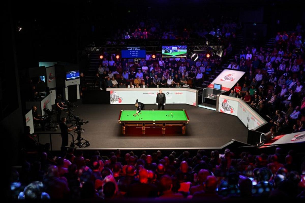 England's Kyren Wilson plays a shot on day two of his World Championship Snooker final  against Wales' Jak Jones during the afternoon session at The Crucible in Sheffield, northern England on May 6, 2024.   Oli SCARFF / AFP