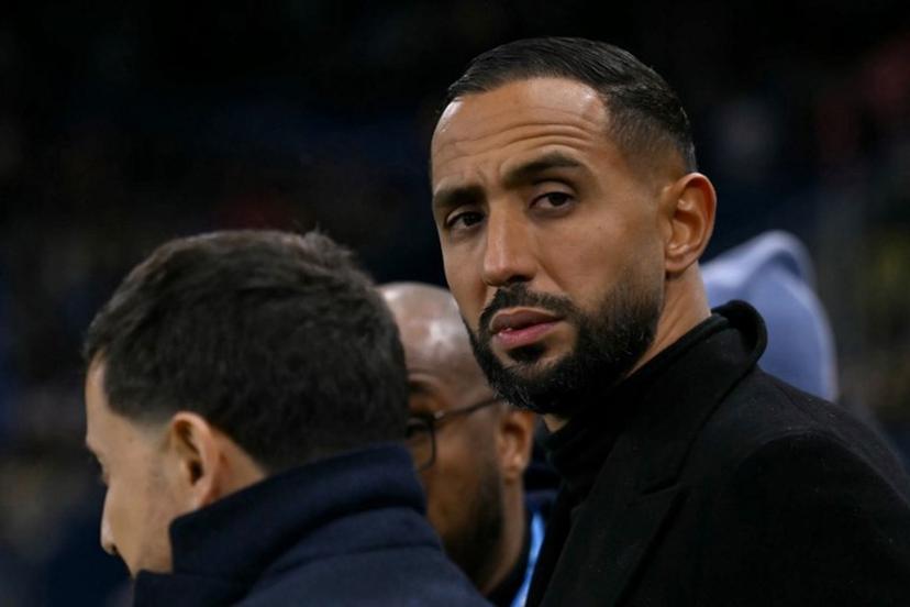 Marseille's French-Moroccan sporting director Medhi Benatia (R) looks on ahead of the French Cup round of 32 football match between FC Bayeux and Olympique de Marseille (OM) at the Michel-d'Ornano Stadium in Caen on January 13, 2026.  LOU BENOIST / AFP