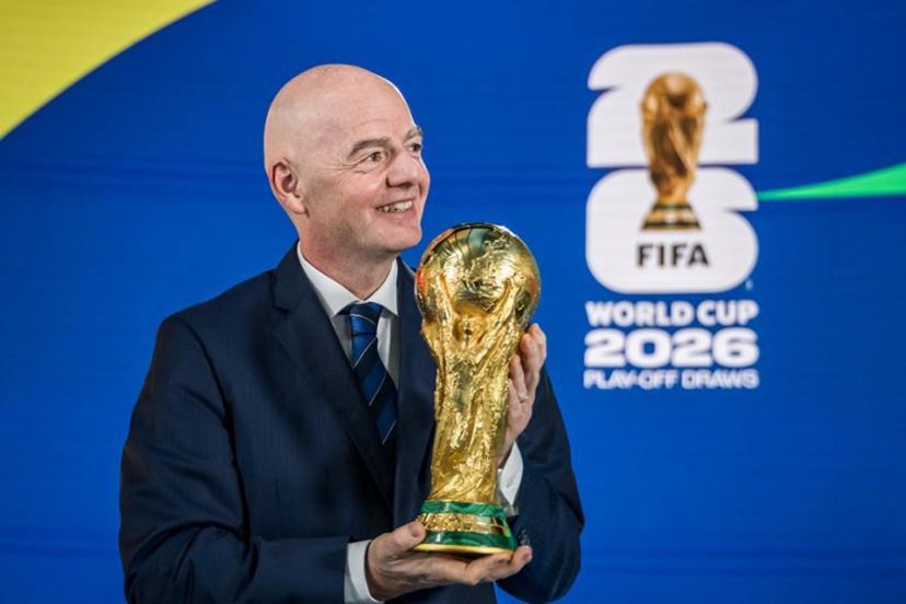 FIFA President Gianni Infantino poses with the 2026 FIFA World Cup trophy following the 2026 FIFA World Cup European Play-Off draw at the FIFA's Home of Football in Zurich on November 20, 2025.  Fabrice COFFRINI / AFP
