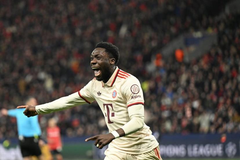 (FILES) Bayern Munich's Canadian defender #19 Alphonso Davies celebrates after scoring the 0-2 goal during the EFA Champions League last 16, second leg, football match between Bayer Leverkusen and Bayern Munich in Leverkusen, western Germany on March 11, 2025.  Bayern Munich are facing the prospect of battling for both the league title and the Champions League without key players Dayot Upamecano and Alphonso Davies, who returned from international duty injured, the German giants said on March 26, 2025. INA FASSBENDER / AFP