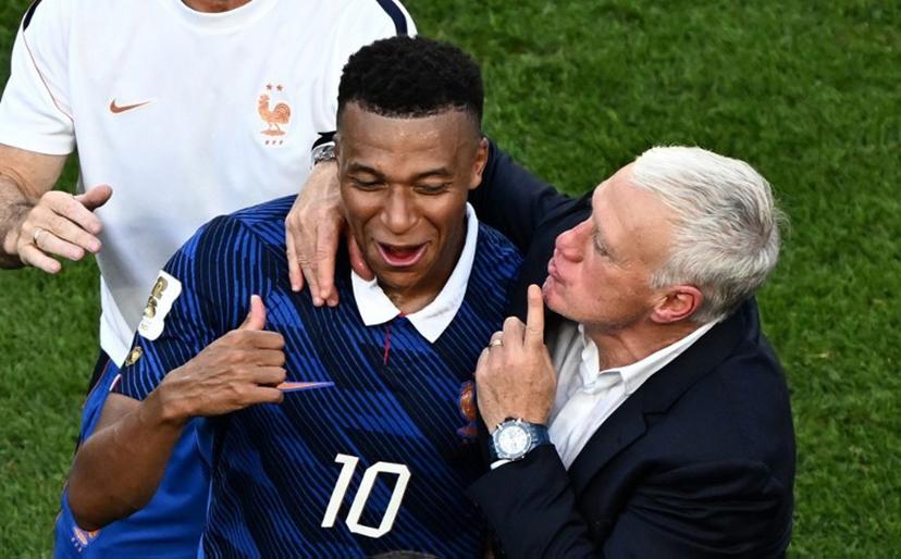 France's forward #10 Kylian Mbappe celebrates with his coach Didier Deschamps after winning the 2026 World Cup round of 16 football match between Paraguay and France at the Philadelphia Stadium in Philadelphia on July 4, 2026.   Jewel SAMAD / AFP