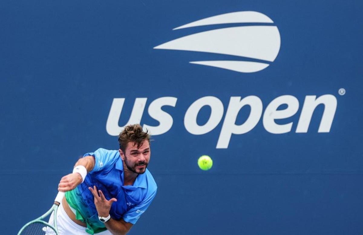 Switzerland's Stan Wawrinka serves to Italy's Matteo Berrettini in their men's singles first round tennis match on day two of the US Open tennis tournament at the USTA Billie Jean King National Tennis Center in New York City on August 31, 2026.  KENA BETANCUR / AFP