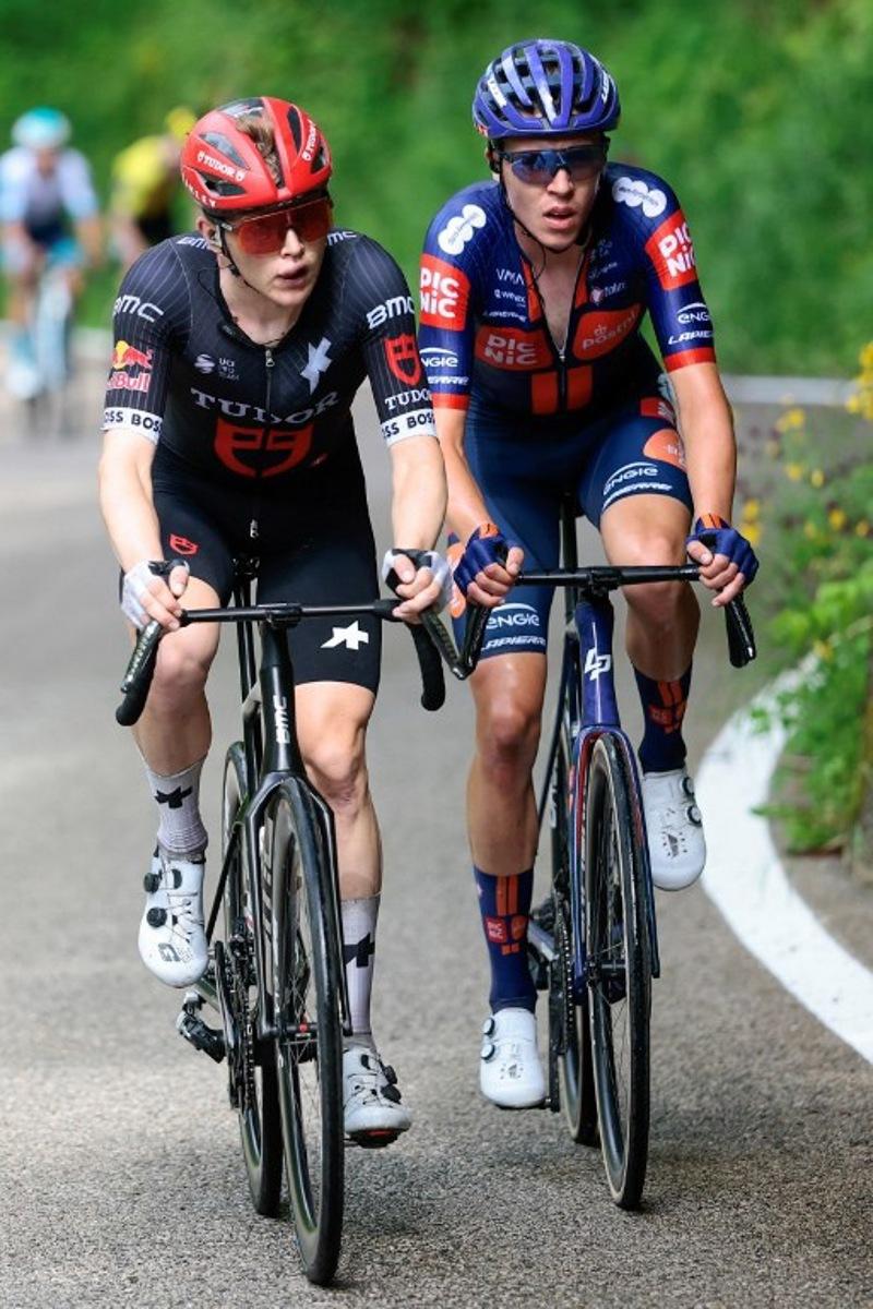 Tudor Pro Cycling Team's Australian rider Michael Storer (L) and Team Picnic PostNL's British rider Max Poole climb Santa Barbara during the 16th stage of the 108th Giro d'Italia cycling race of 203kms from Piazzola sul Brenta to San Valentino on May 27, 2025.  Luca Bettini / AFP