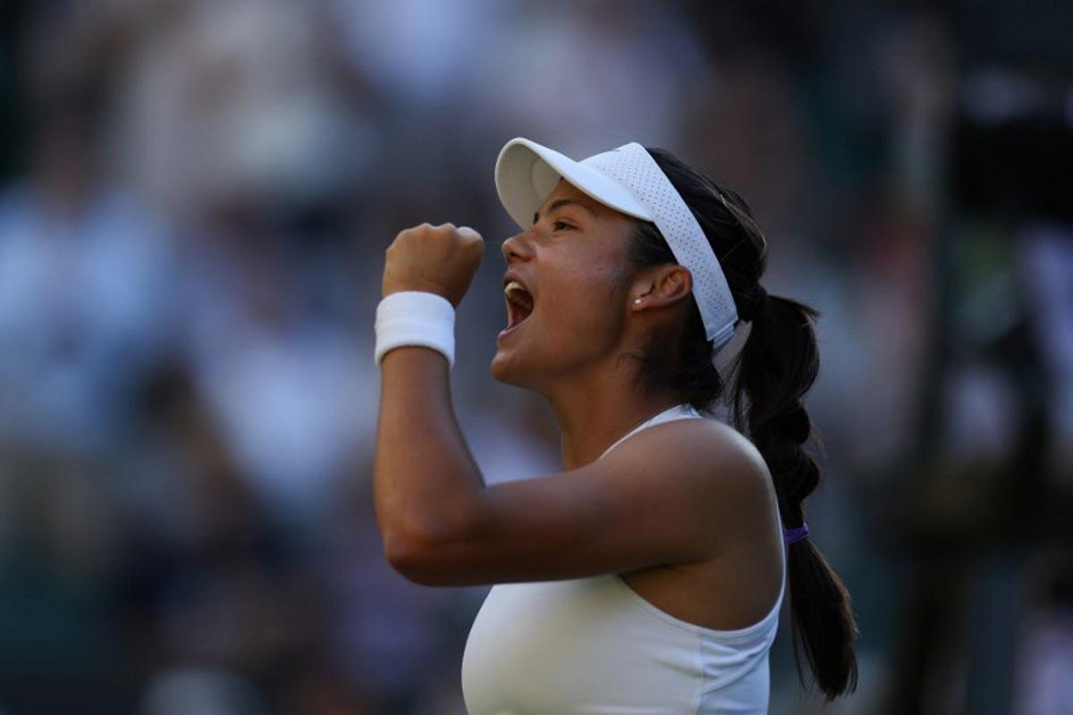 Britain's Emma Raducanu celebrates after winning against Britain's Mingge Xu the women's singles first round tennis match on the first day of the 2025 Wimbledon Championships at The All England Lawn Tennis and Croquet Club in Wimbledon, southwest London, on June 30, 2025.  Adrian Dennis / AFP