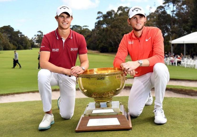 Thomas Detry (L) and Thomas Pieters of Belgium celebrate with the trophy after winning the World Cup of Golf at the Metropolitan Golf Club in Melbourne on November 25, 2018.  William WEST / AFP -- IMAGE RESTRICTED TO EDITORIAL USE - STRICTLY NO COMMERCIAL USE --

