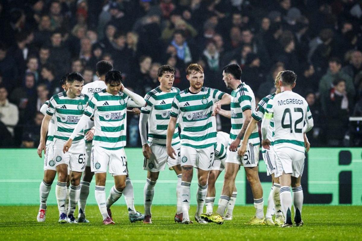 Players of Celtic FC celebrate their 1-2 goal during the UEFA Europa League football match Feyenoord Rotterdam and Celtic Glasgow at the Feyenoord Stadium 'De Kuip' in Rotterdam on Novemberr 27, 2025.  Koen van Weel / ANP / AFP