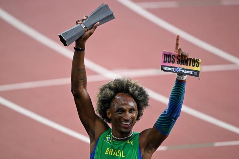 Brazil's Alison Dos Santos celebrates with his trophy after winning men's 400m hurdles final during the World Athletics Ultimate Championship at the Gyula Zsivotzky National Athletics Centre, in Budapest on September 13, 2026.  Attila KISBENEDEK / AFP