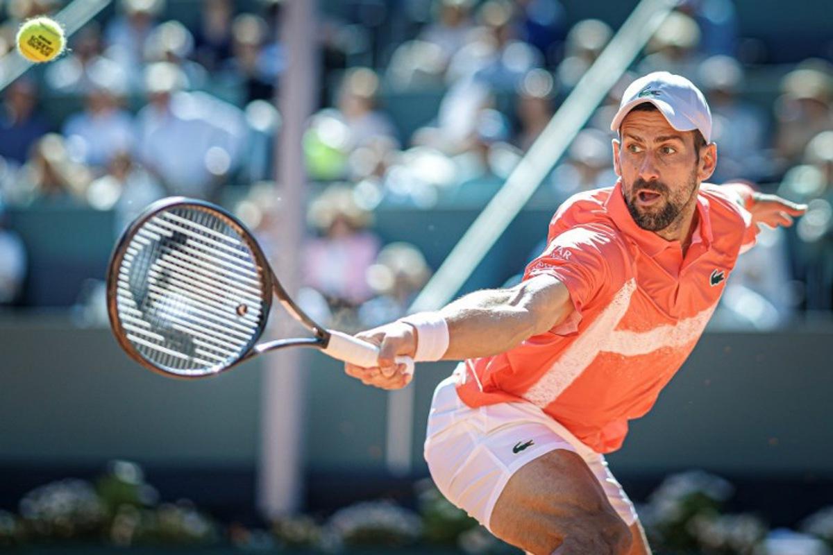 Serbia's Novak Djokovic returns a ball to Poland's Hubert Hurkacz during their men's singles final match at the ATP 250 Geneva Open tennis tournament in Geneva on May 24, 2025.  VALENTIN FLAURAUD / AFP