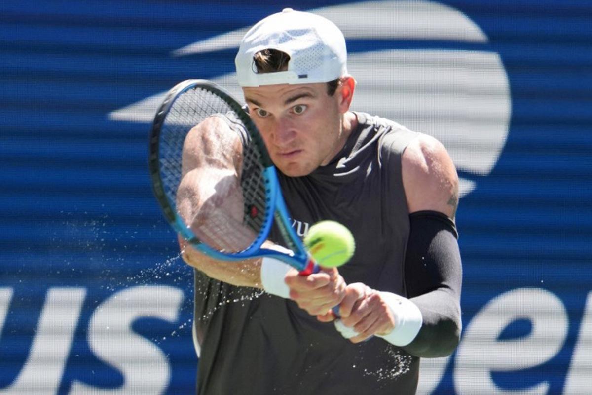 Britain's Jack Draper plays a return to Argentina's Federico Agustin Gomez during their men's singles first round tennis match on day two of the US Open tennis tournament at the USTA Billie Jean King National Tennis Center in New York City, on August 25, 2025.  TIMOTHY A. CLARY / AFP