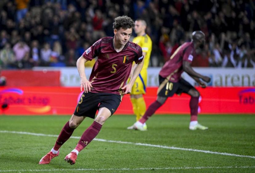 Belgium's midfielder #05 Maxim De Cuyper celebrates after scoring his team's first goal during the UEFA Nations League Play-offs Group A - second leg football match between Belgium and Ukraine at the Arena Genk - Cegeka Arena stadium in Genk, northeastern Belgium, on March 23, 2025.  JOHN THYS / AFP