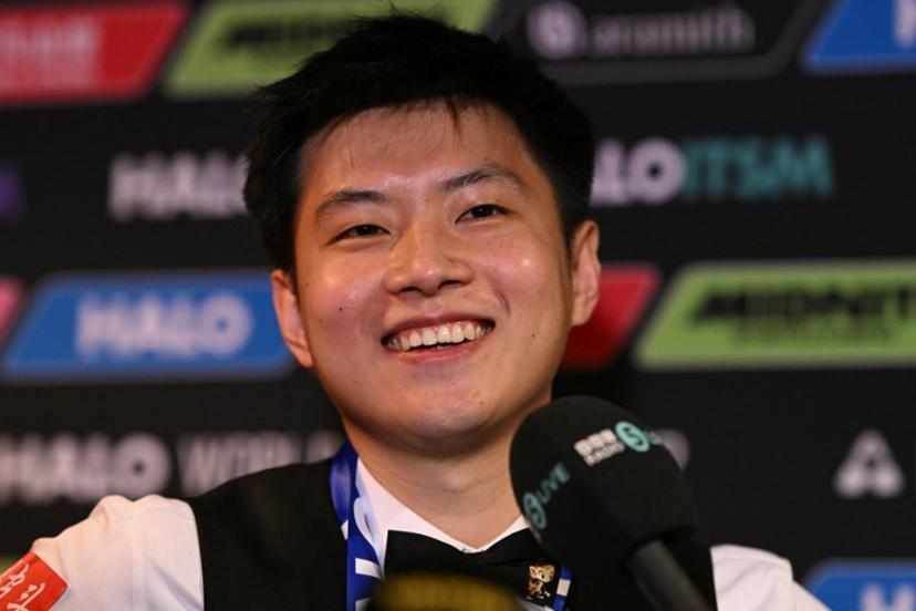 China's Zhao Xintong reacts at a press conference after victory over Wales' Mark Williams in the World Championship Snooker final at The Crucible in Sheffield, northern England on May 5, 2025.  Zhao Xintong became the first Chinese player to win the World Snooker Championship as the qualifier completed his stunning march to the title with a 18-12 victory against Mark Williams in the final on Monday. Oli SCARFF / AFP