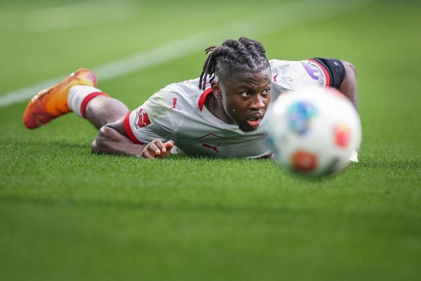 Leipzig's Belgian forward #09 Johan Bakayoko is lying on the pitch during the German first division Bundesliga football match between VfL Wolfsburg and RB Leipzig in Wolfsburg, northern Germany on September 27, 2025.  RONNY HARTMANN / AFP