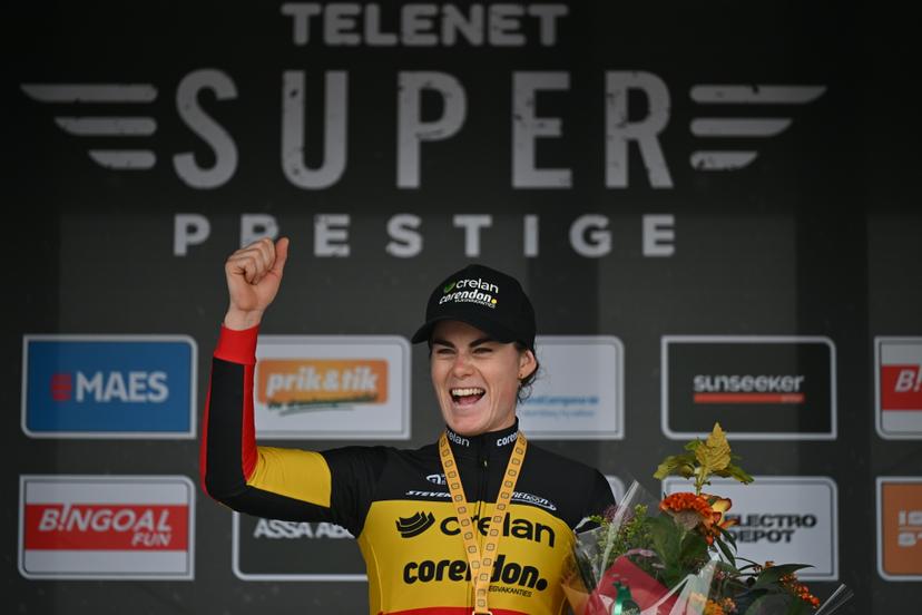 Belgian Marion Norbert Riberolle celebrates on the podium after winning the women elite race of the Cyclocross Ruddervoorde, Sunday 19 October 2025 in Ruddervoorde, stage 2 (out of 7) of the Superprestige cyclocross cycling competition. BELGA PHOTO LUC CLAESSEN