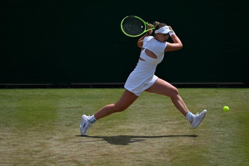 Czech Republic's Barbora Krejcikova returns to Czech Republic's Karolina Muchova during their women's singles round of sixteen tennis match on the seventh day of the 2026 Wimbledon Championships at The All England Lawn Tennis and Croquet Club in Wimbledon, southwest London, on July 5, 2026.  Glyn KIRK / AFP