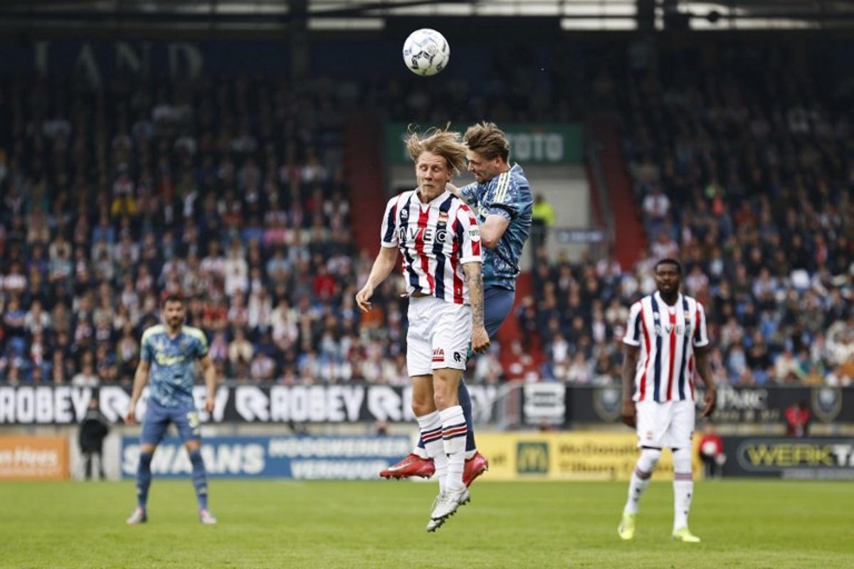 Willem II's Dutch midfielder #08 Jesse Bosch (L) fights for the ball with Ajax's Dutch midfielder #08 Kenneth Taylor during the Dutch Eredivisie football match between Willem II Tilburg and AFC Ajax Amsterdam at Koning Willem II Stadium  in Tilburg on April 13, 2025.  MAURICE VAN STEEN / ANP / AFP