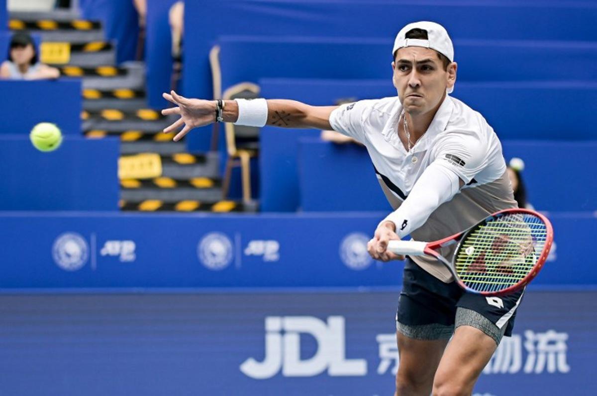 Chile's Alejandro Tabilo hits a return to Australia's Christopher O'Connell during their men's singles quarter-final match at the Chengdu Open tennis tournament in Chengdu, in China's southwest Sichuan province on September 21, 2025.  STR / AFP