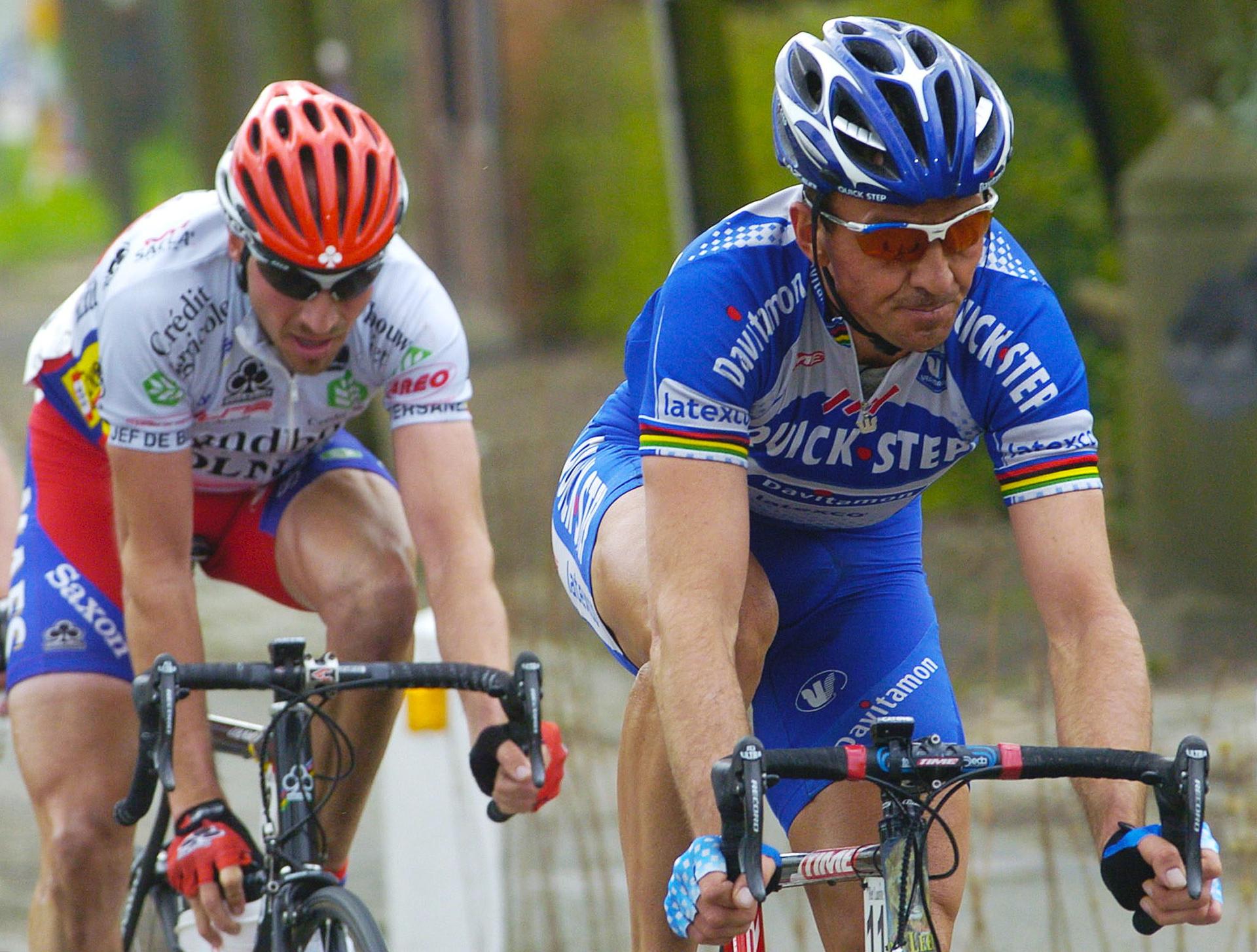 BRU167 - 20040414 - SCHOTEN, BELGIUM : Yohan Museeuw (R) and Ludo Dierckxsens (L) ride during the Scheldeprijs cycling race, Wednesday 14 April 2004, in Schoten.  BELGA PHOTO BENOIT DOPPAGNE