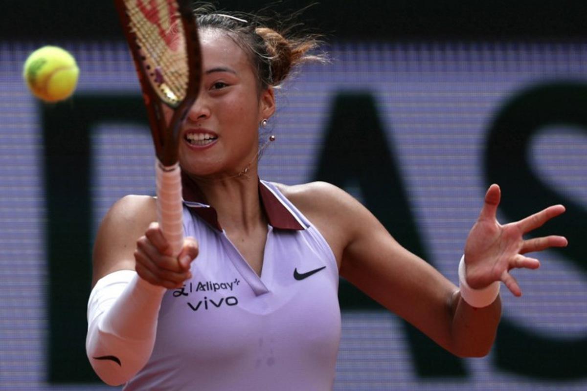 China's Zheng Qinwen plays a forehand return to Russia's Liudmila Samsonova during their women's singles match on day 8 of the French Open tennis tournament on Court Suzanne-Lenglen at the Roland-Garros Complex in Paris on June 1, 2025.  Alain JOCARD / AFP