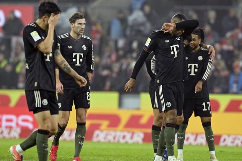 (L-R) Bayern Munich's South Korean defender #03 Kim Min-Jae, Bayern Munich's German midfielder #08 Leon Goretzka, Bayern Munich's German defender #04 Jonathan Tah and Bayern Munich's French midfielder #17 Michael Olise react during the German first division Bundesliga football match between FC Cologne and FC Bayern Munich in Cologne, western Germany on January 14, 2026.  INA FASSBENDER / AFP